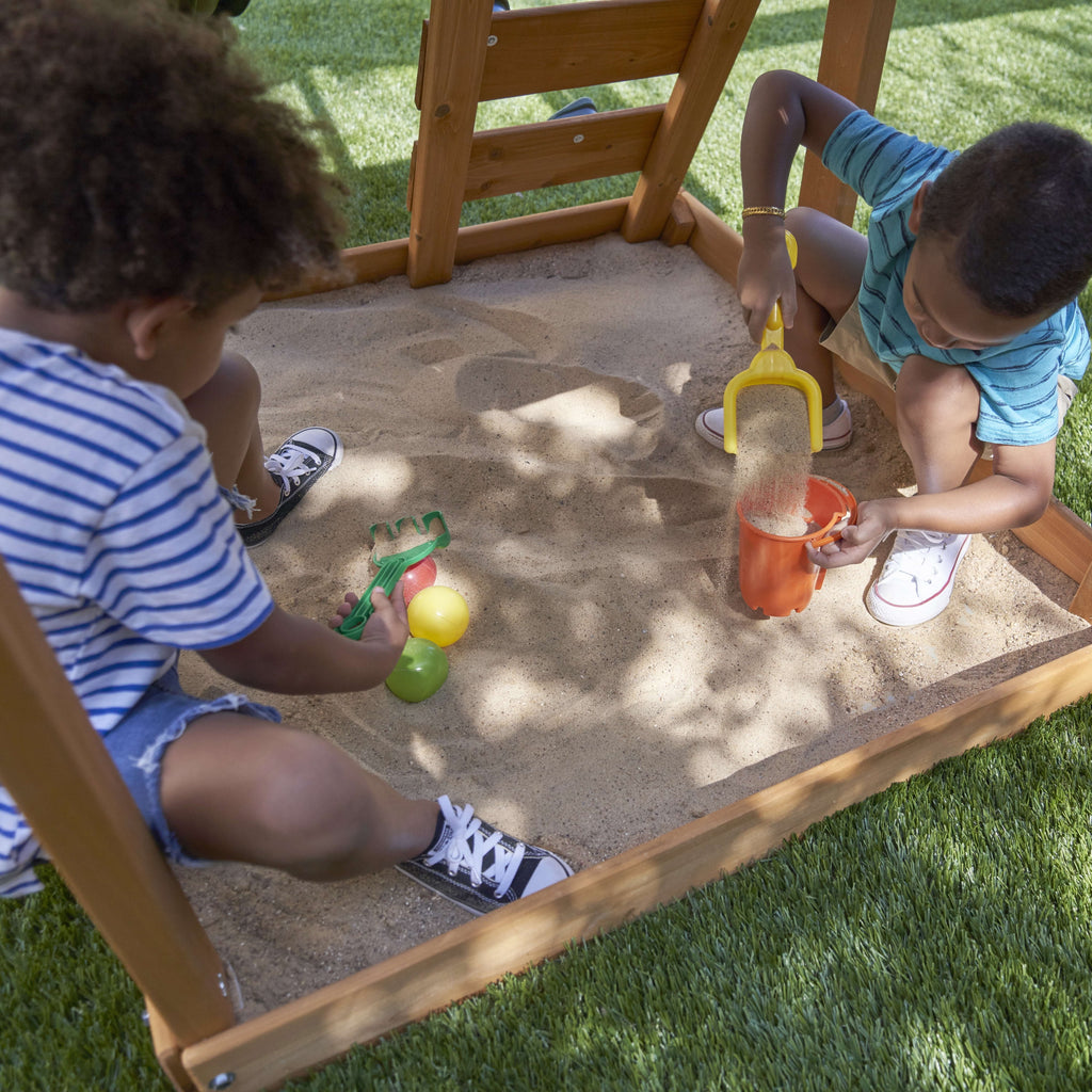 KidKraft Ainsley Wooden Outdoor Swing Set with Slide and Rock Wall